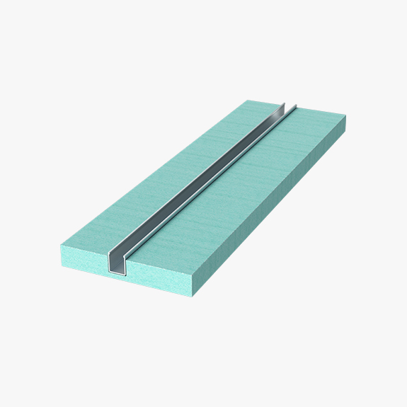 Green foam insulation block with a metal channel running along its length.