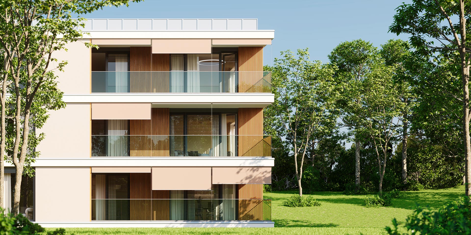Modern four-story apartment building with glass balconies and wood slat accents, set against a green lawn and trees under a blue sky.